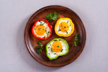 Yellow , red and green pepper with fried eggs