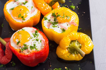 Baked pepper stuffed with bacon and eggs