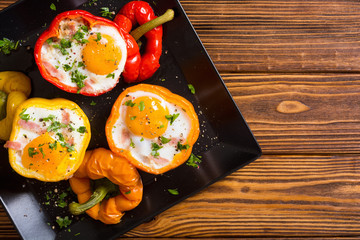 Baked pepper stuffed with bacon and eggs