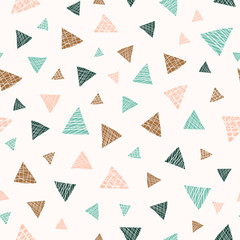 Vector seamless pattern background features hand-drawn scattered triangles with texture in brown, teal, turquoise and blush colors. Perfect for packaging, graphic, backdrops, wrapping paper, decor.