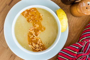 Turkish Lentil Soup with fried butter sauce / Mercimek Corbasi at Restaurant.