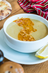 Turkish Lentil Soup with fried butter sauce / Mercimek Corbasi at Restaurant.
