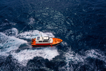 Pilots boat aerial view sailing in blue ocean