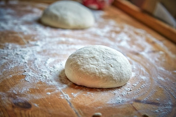 Fototapeta na wymiar Raw dough on the table at home