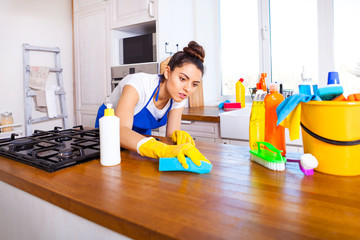 Beautiful young woman makes cleaning the house. Girl cleaning kitchen. Set.