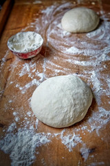 Fototapeta na wymiar Raw dough on the table at home
