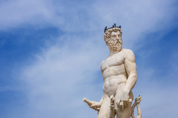 Neptune God of the Sea. Marble statue from the Fountain of Neptune, erected in 1565 in Piazza delle Signoria Square, in the historic center of Florence (with copy space)