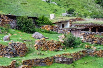 Small rural huts made of stone in the mountains