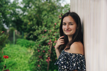 Fototapeta premium Photo of beautiful young woman wearing dress smiling while walking outdoor in countryside