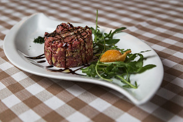 Beef tartare a summer appetizer to serve cold
