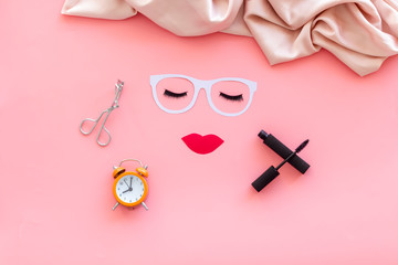 Visagiste work space with face model on pink background top view