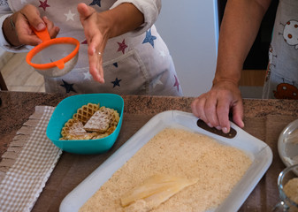 Two caucasian people in friendship stay in the kitchen enjoying prepare meal together.Family positive moments