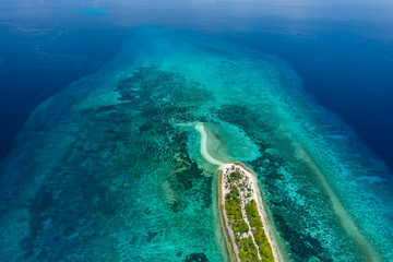 Aerial drone view of a beautiful, tiny tropical island surrounded by coral reef (Kalanggaman Island, Cebu)