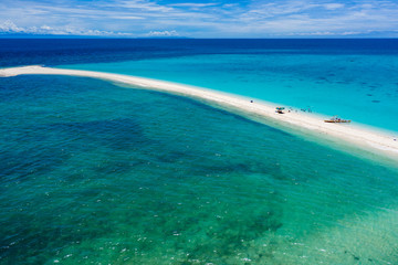 Aerial view of a tiny offshore sandbar and tropical coral reef (White Island)