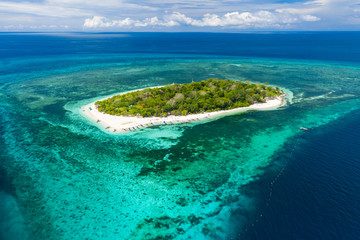 Fototapeta na wymiar Aerial view of tropical Mantigue island off the coast of Camiguin in the Philippines