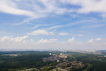 Fototapeta na wymiar The panoramic city view from high place in the sunny day