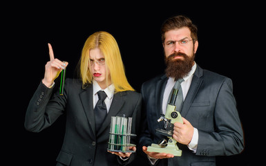 Science. Chemistry. Test tubes. Success. Education. Woman with chemical test tubes. Girl with microscope. Laboratory. Girl conducts an experiment.