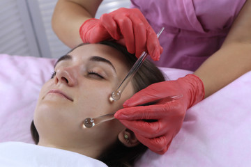 Young and beautiful woman during  massage with crystal fingers