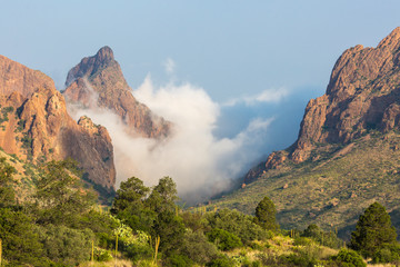 Clouds passing over 'The Window' in the Chisos Basin during the day in Big Bend National Park...