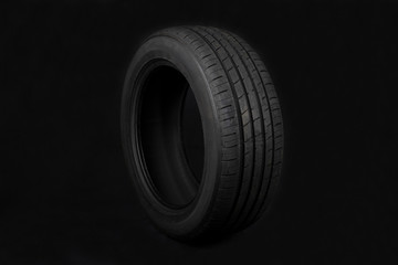 Car tires on black background. Shop Tires and wheels.