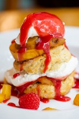 Biscuit with peaches, strawberries and cream
