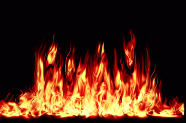 Bright, burning flame on a black background. Fire and center of ignition.