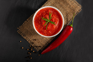 Traditional Maghrebi hot chili pepper sauce paste harissa. Tunisia and Arabic cuisine adjika