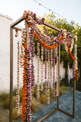 ceremony backdrop with hanging flowers