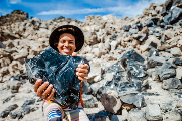Woman holding obsidian 