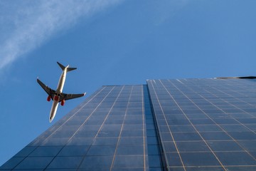 Skyscrapers buildings and a plane flying to the skyscraper downtown and business district