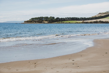 sunny Australian beach in Cremorne, Tasmania