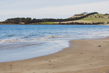 sunny Australian beach in Cremorne, Tasmania