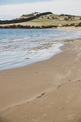sunny Australian beach in Cremorne, Tasmania