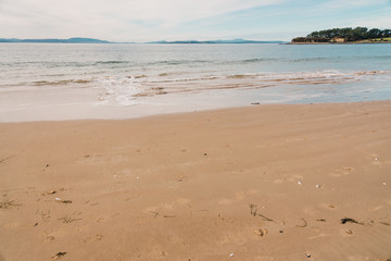 sunny Australian beach in Cremorne, Tasmania