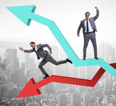Businessman with charts of growth and decline