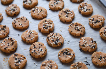 Sesame cookies on baking tray