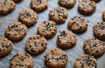 Sesame cookies on baking tray