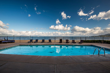 Swimming pool in an old resort next to a beach in a summer