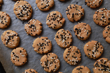 Sesame cookies on baking tray