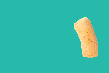 Rod Snack tube isolated on green background with space for copy.