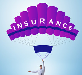 Businessman in insurance concept on parachute