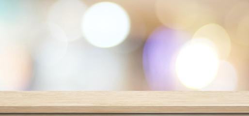 Wooden table, tabletop, desk over blur store with bokeh light background, Empty wooden shelf,...