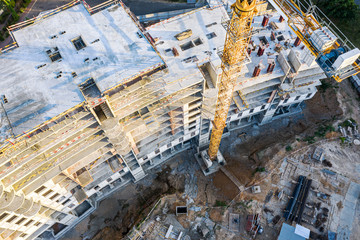 Fototapeta premium building of new modern apartments. crane at construction site. photo captured by drone