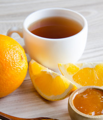 Cup of tea served with orange jam