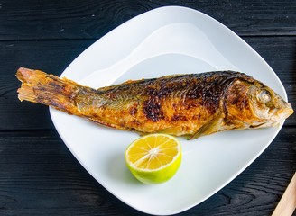 Fried fish served on the plate