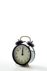 Black alarm clock retro style on white background