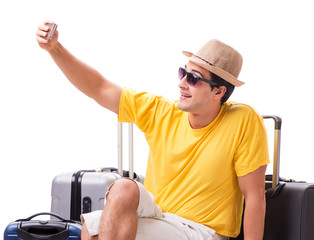 Happy young man going on summer vacation isolated on white