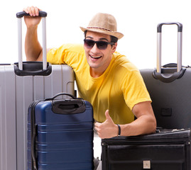 Happy young man going on summer vacation isolated on white