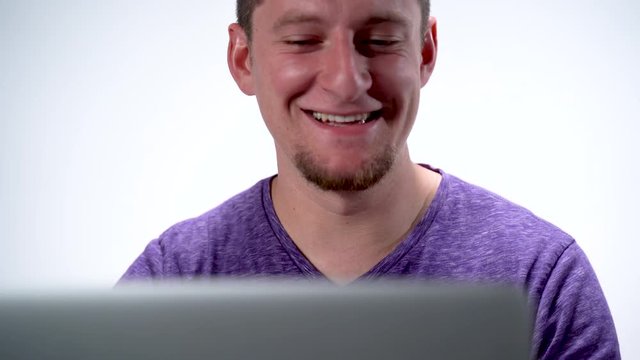Caucasian Handsome Man Laughing at Funny Joke on Internet Video