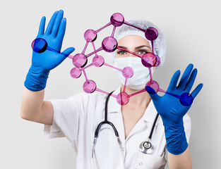 Doctor woman controls virtual molecules in hands.